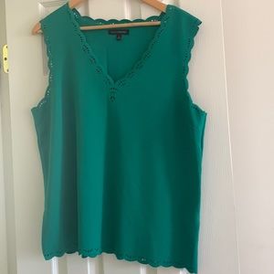 A green top with floral cut work